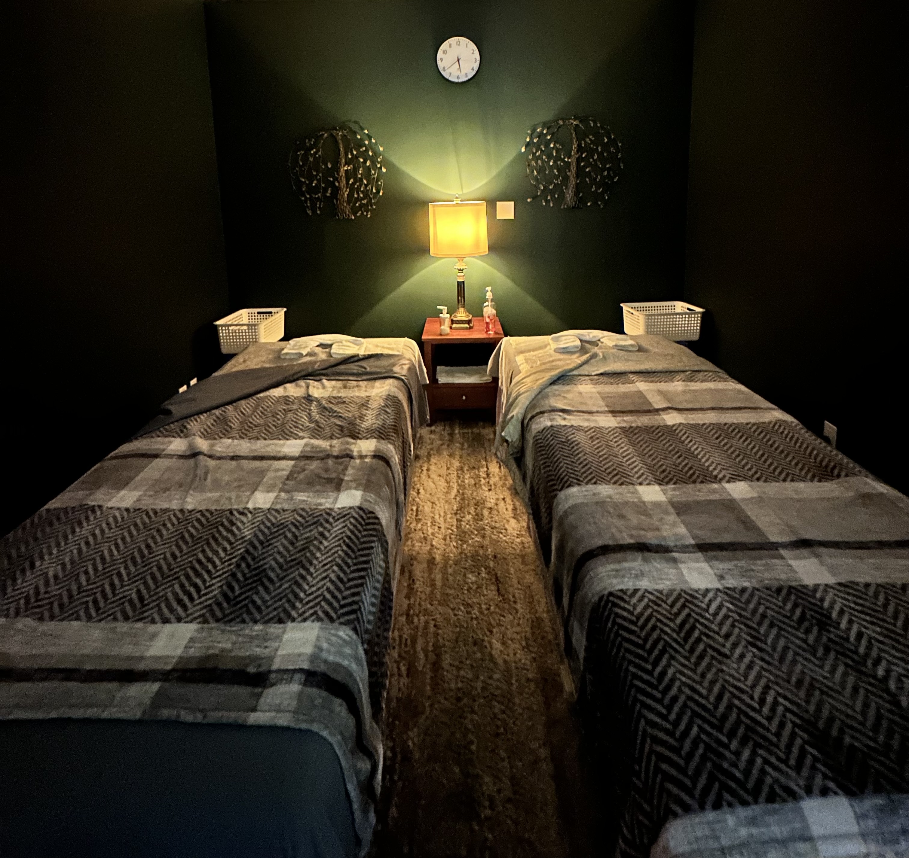 Ace Massage treatment room with two massage tables